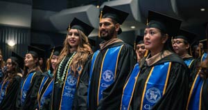 students at graduation in cap and gowns